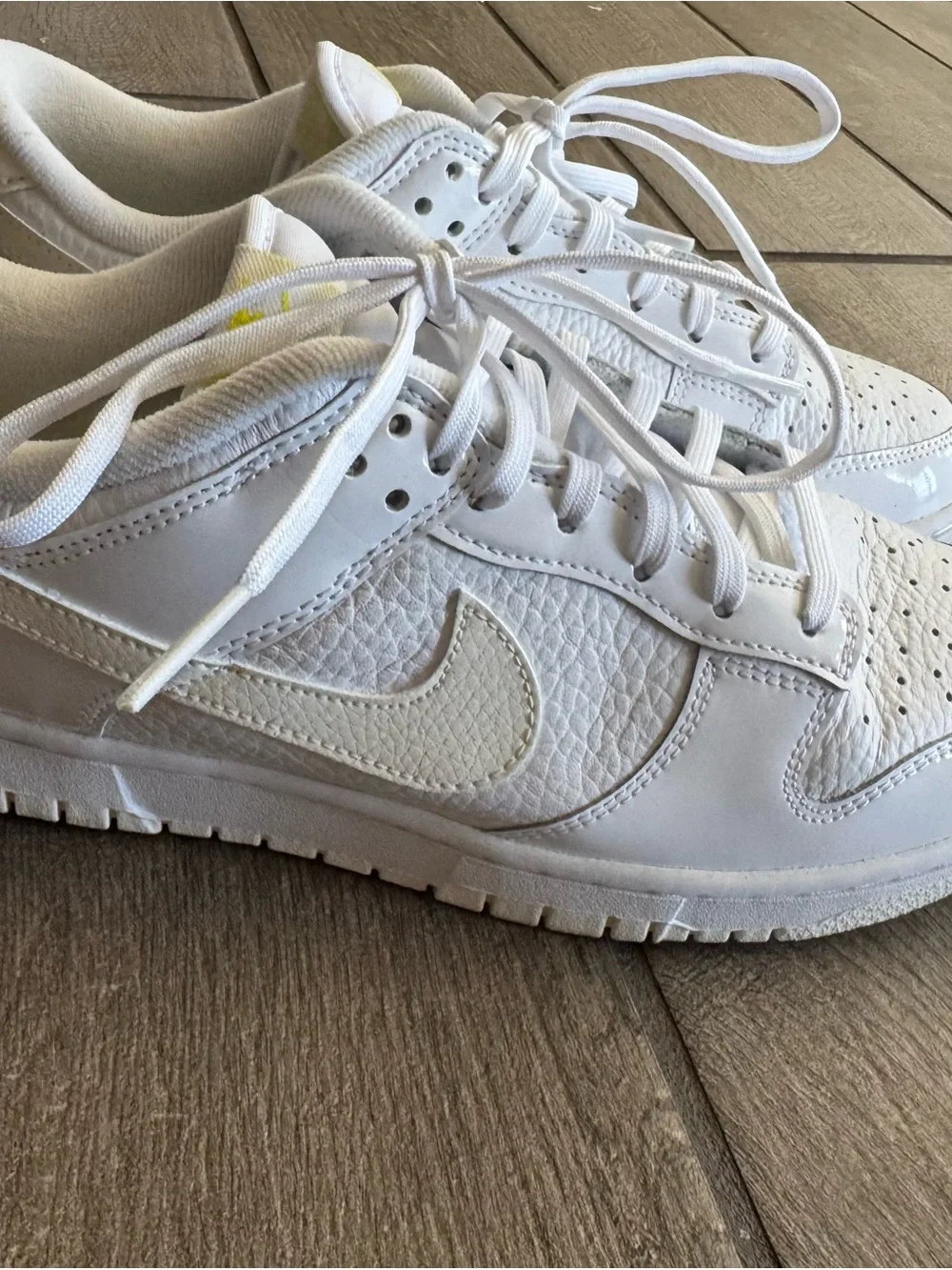 Nike White Low-Top Sneakers with Yellow Logo Accents